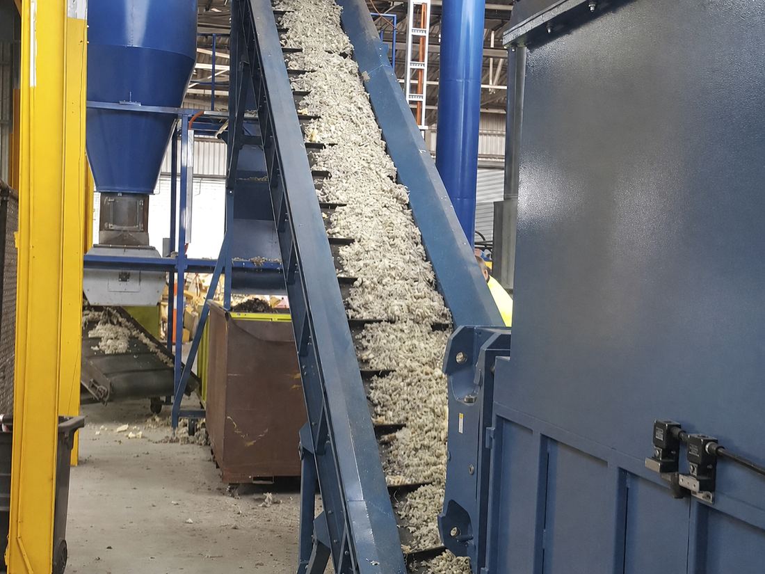 Flock conveyor carrying recovered fibre to the baler at the North Geelong facility